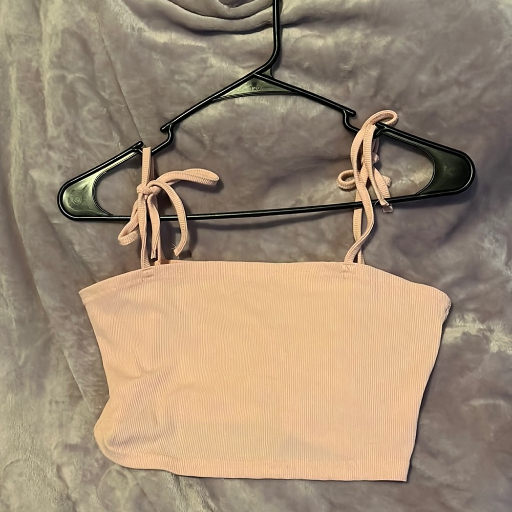 Light pink tank top. Available for discount bundle with other qualifying items!
